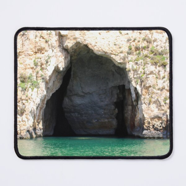 Item preview, Sea Cave Grotto With Turquoise Water and Rocky Cliff Entrance on Coastal Shoreline designed and sold by Nmallia.