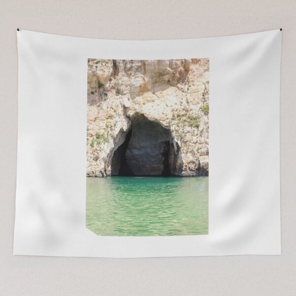 Item preview, Sea Cave Grotto With Turquoise Water and Rocky Cliff Entrance on Coastal Shoreline designed and sold by Nmallia.