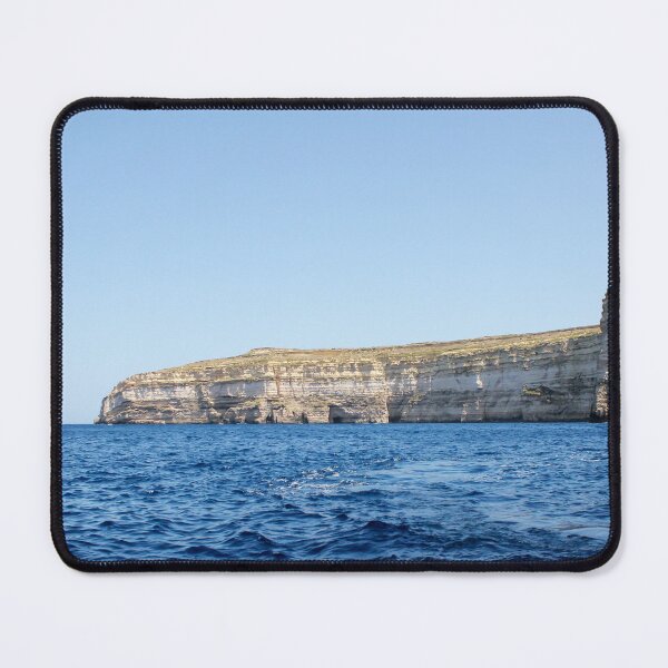 Item preview, Sea Cliffs and Blue Ocean Water Along a Rocky Coastal Landscape Under Clear Sky designed and sold by Nmallia.