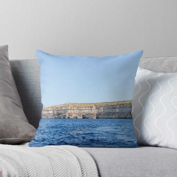 Item preview, Sea Cliffs and Blue Ocean Water Along a Rocky Coastal Landscape Under Clear Sky designed and sold by Nmallia.