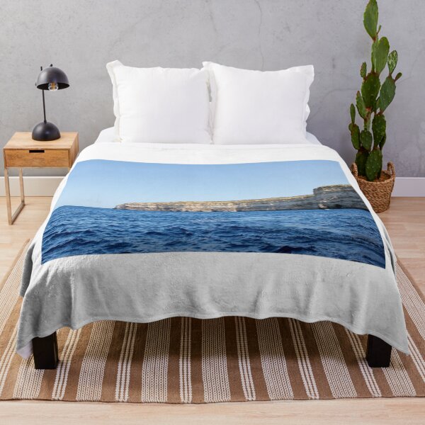 Item preview, Sea Cliffs and Blue Ocean Water Along a Rocky Coastal Landscape Under Clear Sky designed and sold by Nmallia.