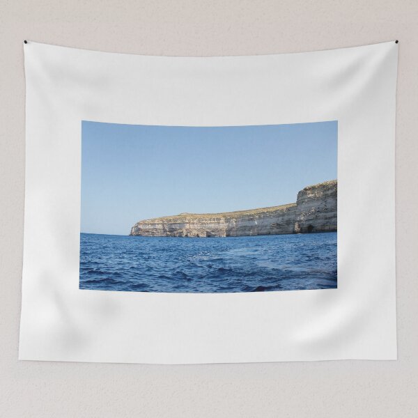 Item preview, Sea Cliffs and Blue Ocean Water Along a Rocky Coastal Landscape Under Clear Sky designed and sold by Nmallia.
