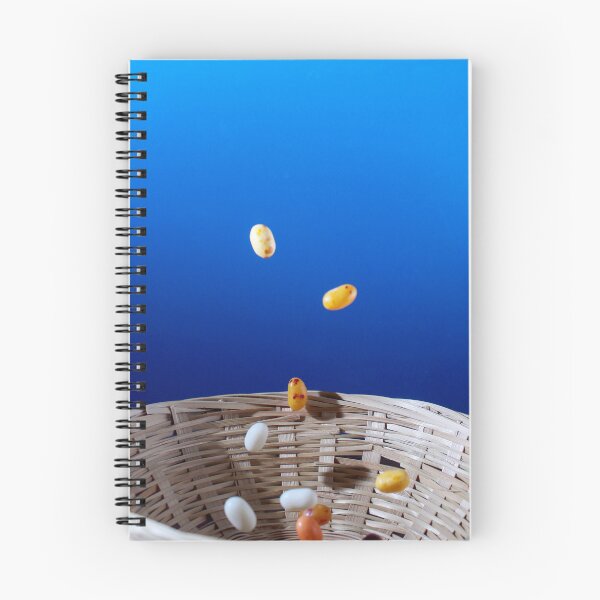Item preview, Colorful Jellybeans Falling Into A Woven Basket Against A Bright Blue Background designed and sold by Nmallia.