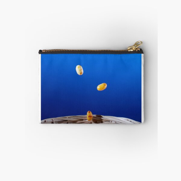 Item preview, Colorful Jellybeans Falling Into A Woven Basket Against A Bright Blue Background designed and sold by Nmallia.