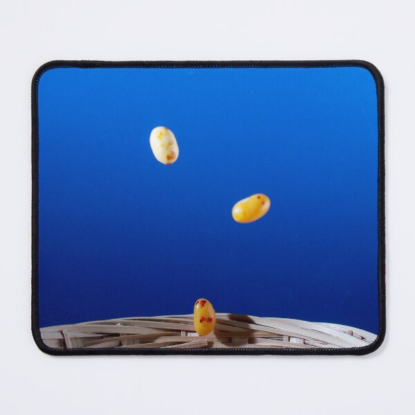 Item preview, Colorful Jellybeans Falling Into A Woven Basket Against A Bright Blue Background designed and sold by Nmallia.