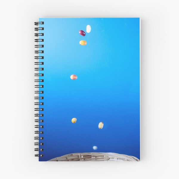 Item preview, Colorful Jellybeans Falling Into A Woven Basket Against A Bright Blue Background designed and sold by Nmallia.