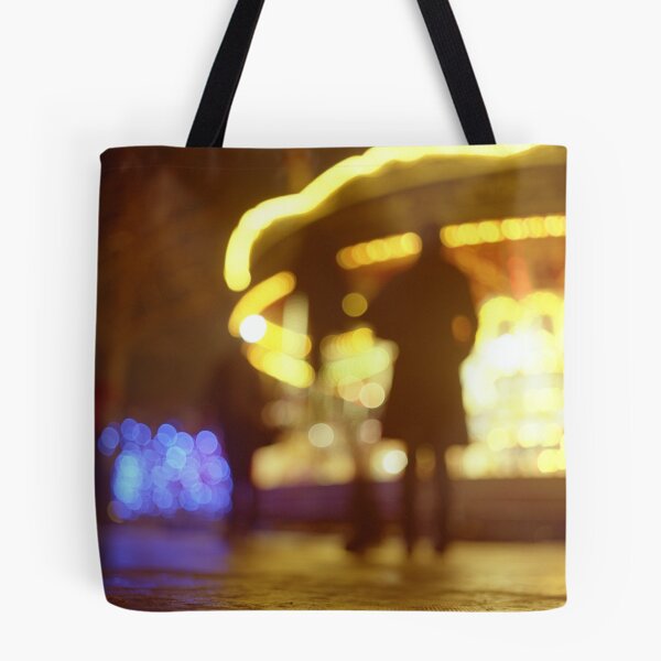 Item preview, People walking in street at night with fairground lights in Hasselblad vintage camera analogue film photo designed and sold by edwardolive.