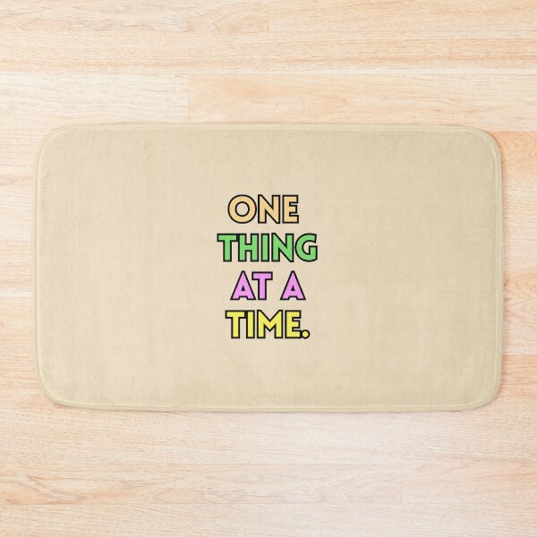 Item preview, One Thing At A Time Text Stickers Prints Posters Wall Art Magnet Home Coffee Cup Decoration TShirt Stationary Notebook Magnet Hat Kitchen Work School Office Redbubble Shop designed and sold by Saritas Boutique Shop.