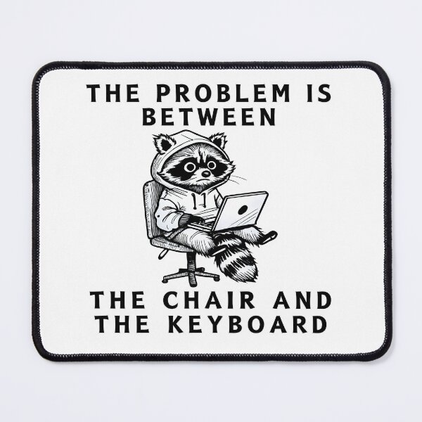 Item preview, The Problem Is Between The Chair And The Keyboard Raccoon Meme Shirt designed and sold by Mavriboy.