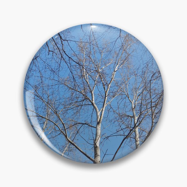 Item preview, Leaflless trees on blue sky background designed and sold by Dniprianka.