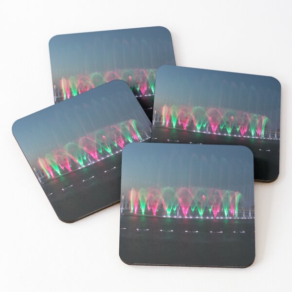 Item preview, Colorful Illuminated Fountain Show At Dusk With Water Jets Over Waterfront designed and sold by Nmallia.