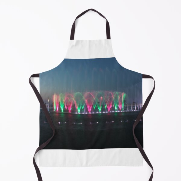 Item preview, Colorful Illuminated Fountain Show At Dusk With Water Jets Over Waterfront designed and sold by Nmallia.
