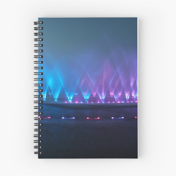Item preview, Colorful Illuminated Fountain Show At Dusk With Water Jets Over Waterfront designed and sold by Nmallia.