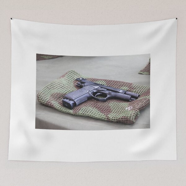 Item preview, Black Pistol Handgun Laid on Camouflage Mesh Cloth Ready for Inspection or Display on Table designed and sold by Nmallia.