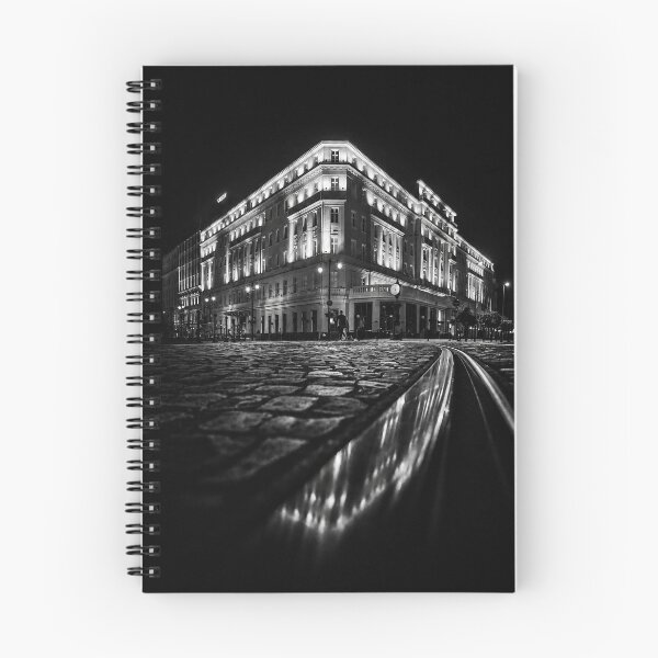 Item preview, Black and white night view of the Radisson Blu Carlton Hotel in Bratislava, Slovakia, with illuminated historic facade, cobblestone street and tram tracks creating a dramatic urban composition. designed and sold by RastislavS.