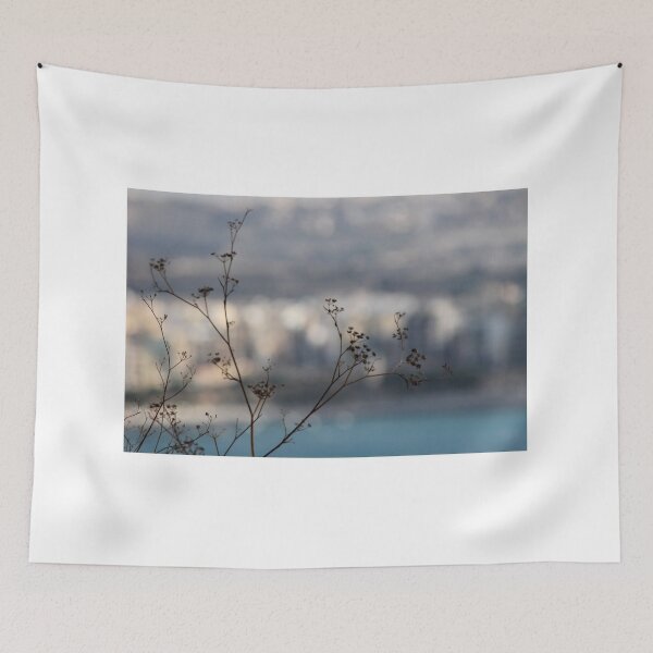 Item preview, Silhouetted Wildflower Stems in Foreground With Blurred Coastal Cityscape and Sea Background designed and sold by Nmallia.