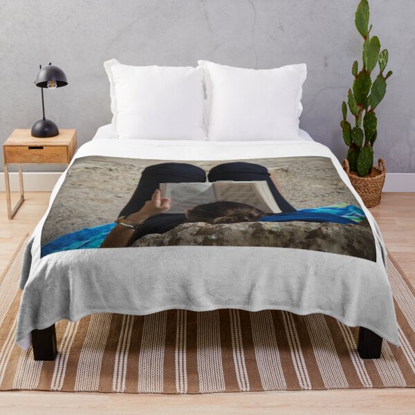Item preview, Woman Reading a Book While Relaxing on a Rocky Beach Towel in Sunlight and Leisure designed and sold by Nmallia.