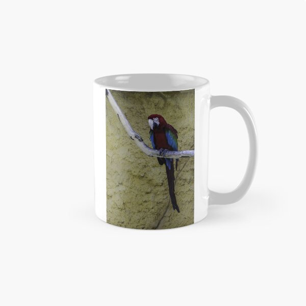 Item preview, Colorful Scarlet Macaw Perched on Branch Against Textured Yellow Background, Tropical Bird Portrait designed and sold by Nmallia.