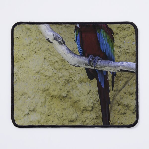 Item preview, Colorful Scarlet Macaw Perched on Branch Against Textured Yellow Background, Tropical Bird Portrait designed and sold by Nmallia.