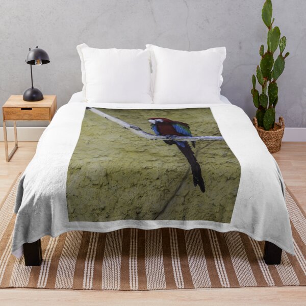 Item preview, Colorful Scarlet Macaw Perched on Branch Against Textured Yellow Background, Tropical Bird Portrait designed and sold by Nmallia.