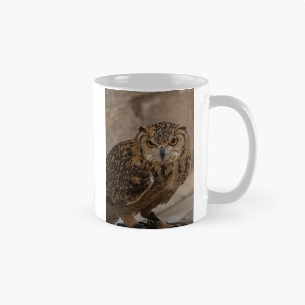 Item preview, Close-Up Portrait of a Eurasian Eagle-Owl With Intense Orange Eyes Perched and Alert designed and sold by Nmallia.