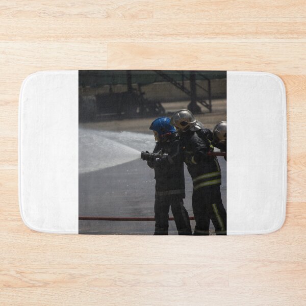 Item preview, Firefighters Team Battling Heavy Smoke and Flames With Hose During Emergency Fire Response Training and Rescue Operation designed and sold by Nmallia.