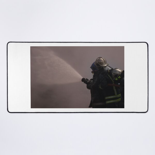 Item preview, Firefighters Team Battling Heavy Smoke and Flames With Hose During Emergency Fire Response Training and Rescue Operation designed and sold by Nmallia.