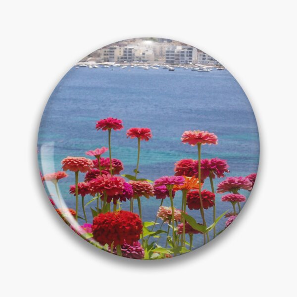 Item preview, Colorful Zinnias in Bloom Overlooking Turquoise Sea and Charming Coastal Town on a Sunny Day designed and sold by Nmallia.