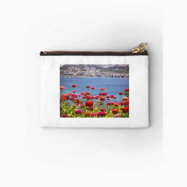 Item preview, Colorful Zinnias in Bloom Overlooking Turquoise Sea and Charming Coastal Town on a Sunny Day designed and sold by Nmallia.