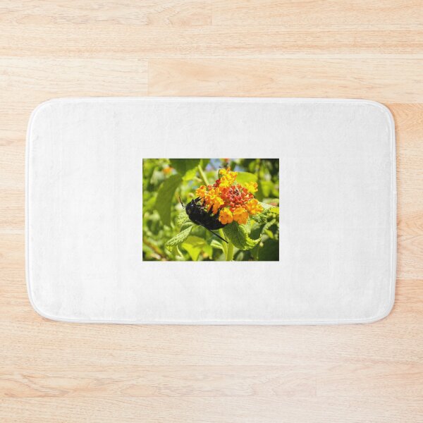 Item preview, Black Bee On Orange Lantana Flower Closeup In Sunny Garden Pollinating Nectar designed and sold by Nmallia.