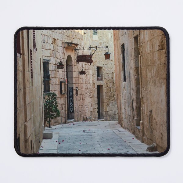 Item preview, Sunlit Narrow Stone Alley With Lanterns and Restaurant Sign in Historic Old Town designed and sold by Nmallia.