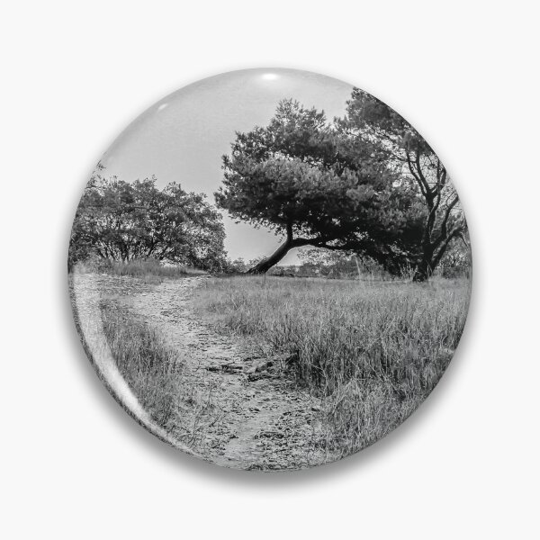 Item preview, Lonely Dirt Path Through Tall Grass Leading To Windblown Trees In Black And White Landscape designed and sold by Nmallia.
