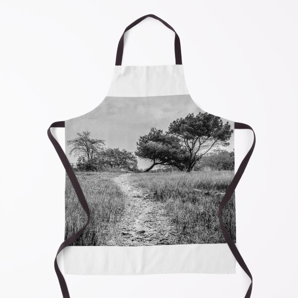 Item preview, Lonely Dirt Path Through Tall Grass Leading To Windblown Trees In Black And White Landscape designed and sold by Nmallia.