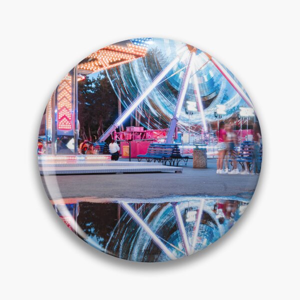 Item preview, Spinning amusement park ride with light trails reflected in a puddle at dusk designed and sold by AndreiWBU.