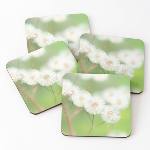 Item preview, White fluffy dandelion seeds macro on green background designed and sold by TanalyFlowers.