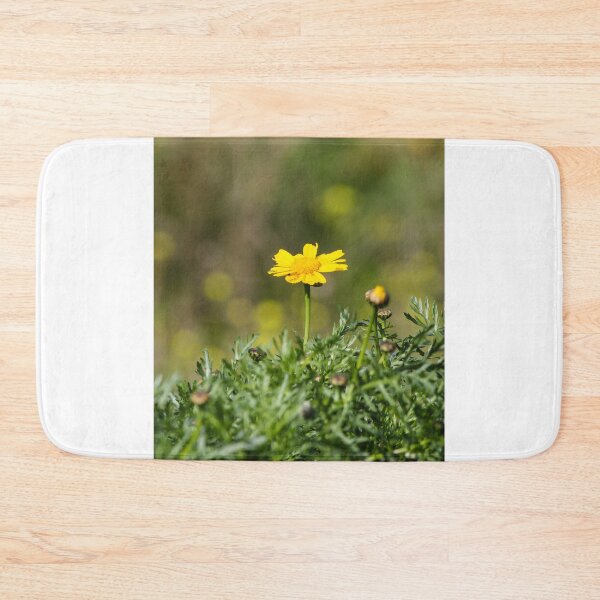 Item preview, Yellow Daisy Among Green Foliage With Small Snail on Stem In Sunny Garden Close-Up designed and sold by Nmallia.