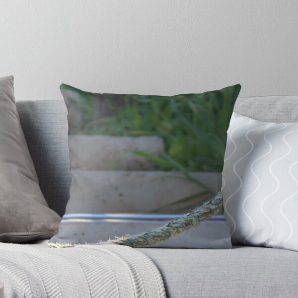 Item preview, Small Sparrow Perched on Frayed Rope Over Concrete Steps With Greenery in Soft Morning Light designed and sold by Nmallia.