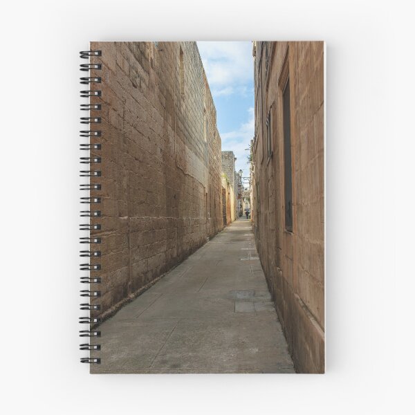 Item preview, Narrow Stone Alley Through Historic Old Town With Sunlit Passage And Distant Figure designed and sold by Nmallia.