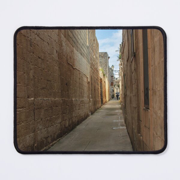 Item preview, Narrow Stone Alley Through Historic Old Town With Sunlit Passage And Distant Figure designed and sold by Nmallia.