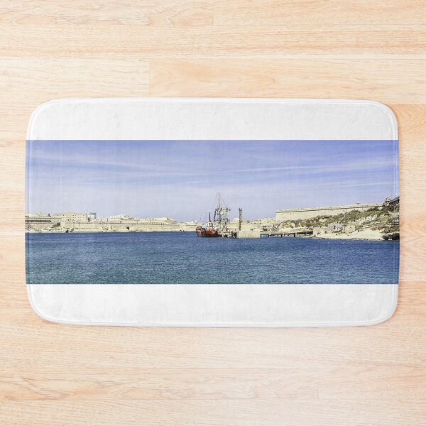 Item preview, Mediterranean Harbor With Historic Fortresses, Calm Blue Sea and Docked Boat Under Clear Sky designed and sold by Nmallia.