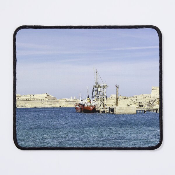 Item preview, Mediterranean Harbor With Historic Fortresses, Calm Blue Sea and Docked Boat Under Clear Sky designed and sold by Nmallia.