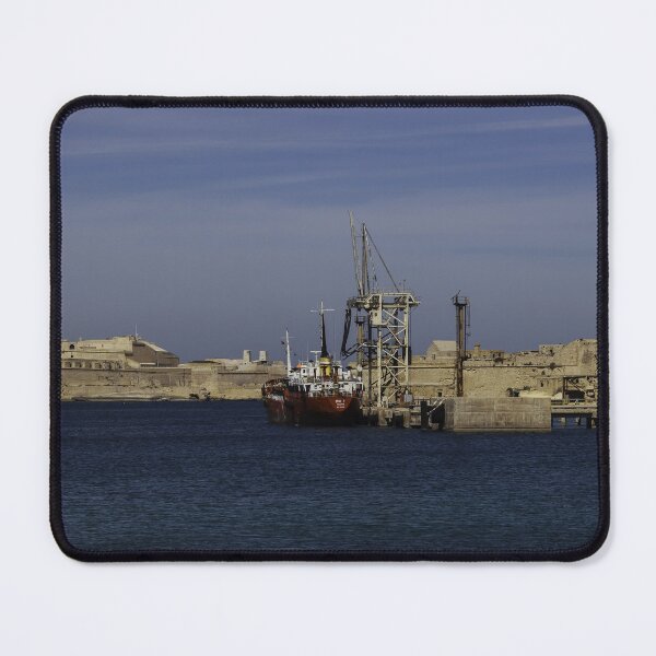 Item preview, Red Cargo Ship Docked Beside Historic Coastal Fort At Calm Harbor Under Blue Sky designed and sold by Nmallia.