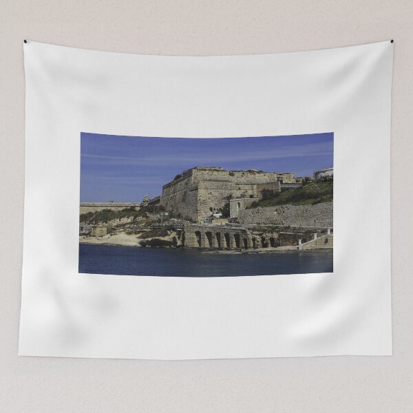 Item preview, Historic Coastal Fortress and Stone Bridge Over Calm Mediterranean Waters With Rugged Ramparts and Waterfront Road designed and sold by Nmallia.