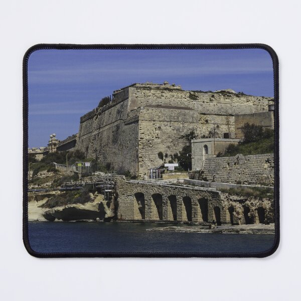 Item preview, Historic Coastal Fortress and Stone Bridge Over Calm Mediterranean Waters With Rugged Ramparts and Waterfront Road designed and sold by Nmallia.