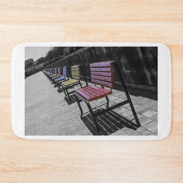 Item preview, Colorful Wooden Benches in a Row Along Urban Walkway With Strong Shadows and Selective Color designed and sold by Nmallia.