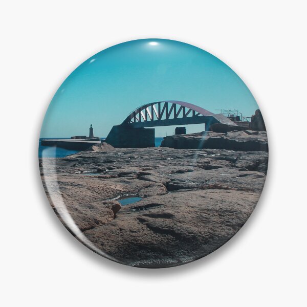 Item preview, Arched Bridge And Lighthouse Over Rocky Coastline At Calm Blue Sea During Clear Day designed and sold by Nmallia.