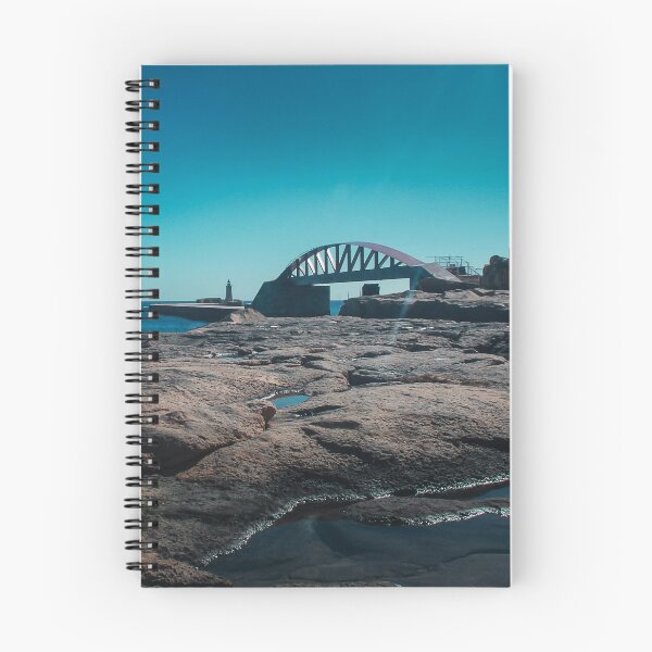 Item preview, Arched Bridge And Lighthouse Over Rocky Coastline At Calm Blue Sea During Clear Day designed and sold by Nmallia.
