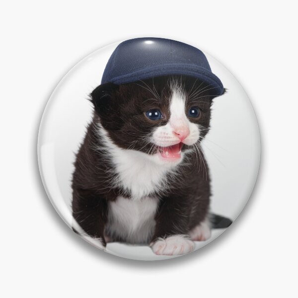 Item preview, Observant Kitten in Cap Poster - Focused Baby Cat Sticker - Attention-Grabbing Pet Graphic for Stationery and Office Decor designed and sold by WildGentlemen.
