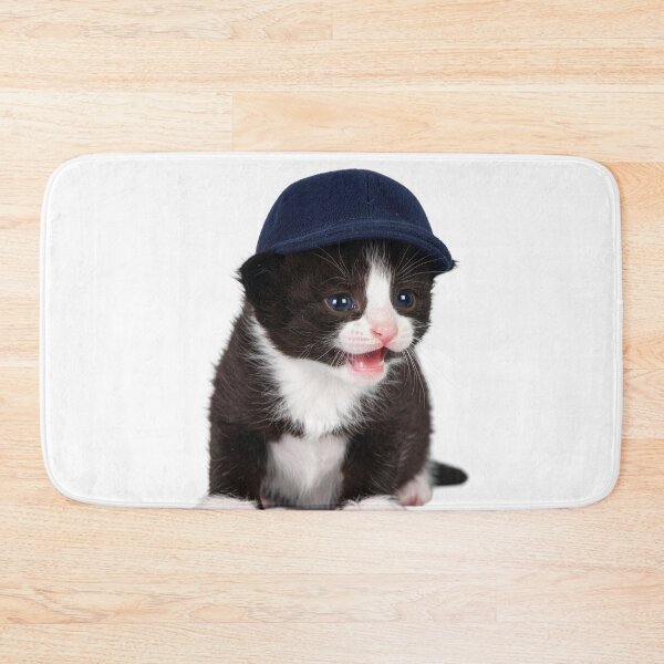 Item preview, Observant Kitten in Cap Poster - Focused Baby Cat Sticker - Attention-Grabbing Pet Graphic for Stationery and Office Decor designed and sold by WildGentlemen.
