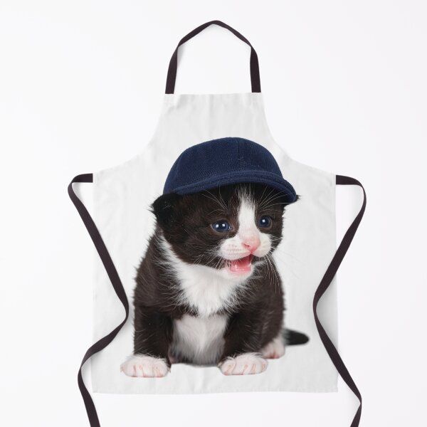 Item preview, Observant Kitten in Cap Poster - Focused Baby Cat Sticker - Attention-Grabbing Pet Graphic for Stationery and Office Decor designed and sold by WildGentlemen.